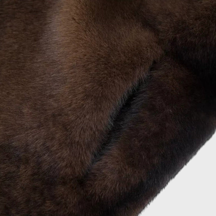 Pūkūtė | Long faux leather coat