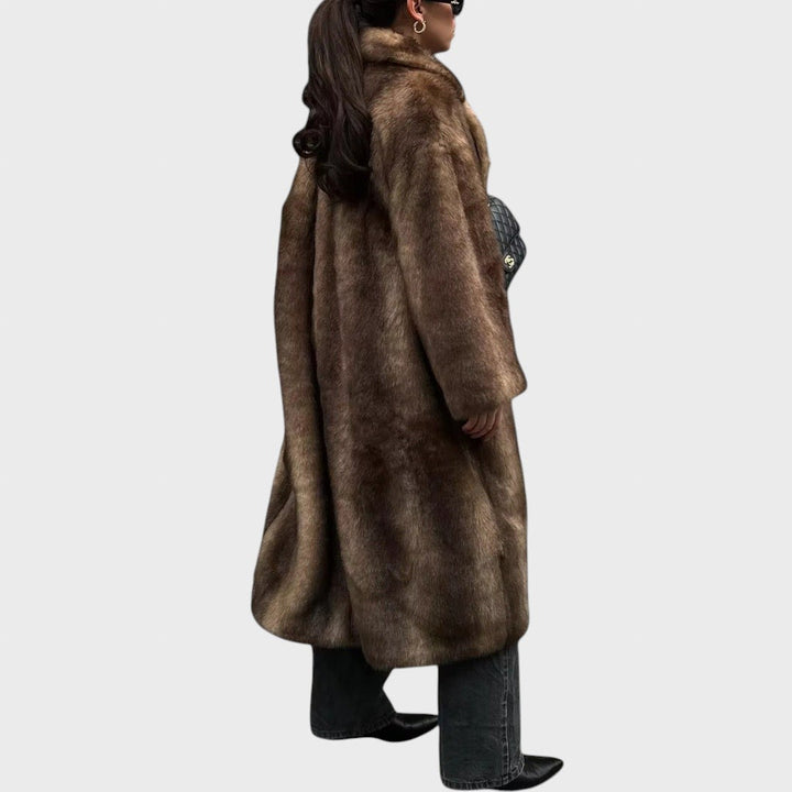 Pūkūtė | Long faux leather coat