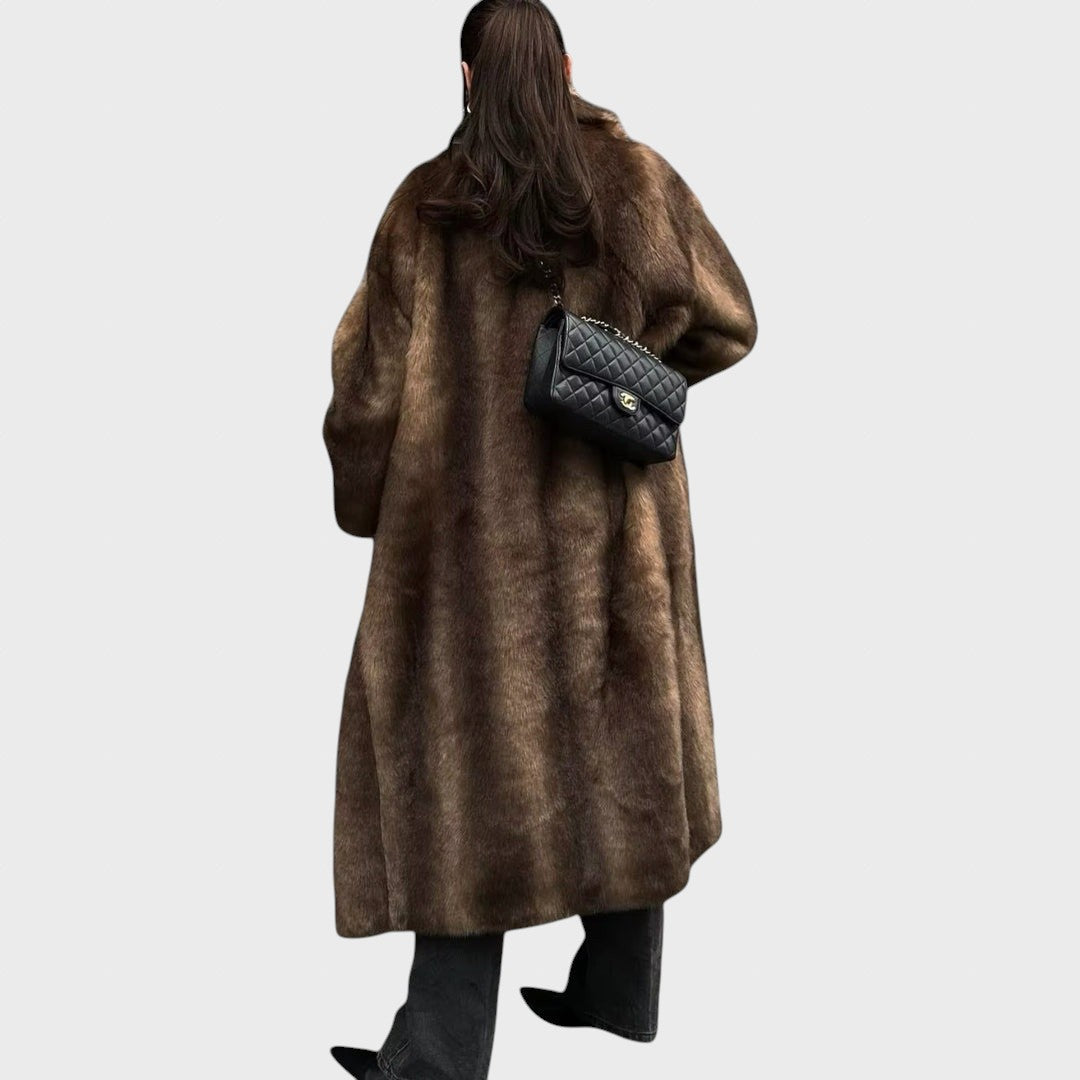 Pūkūtė | Long faux leather coat