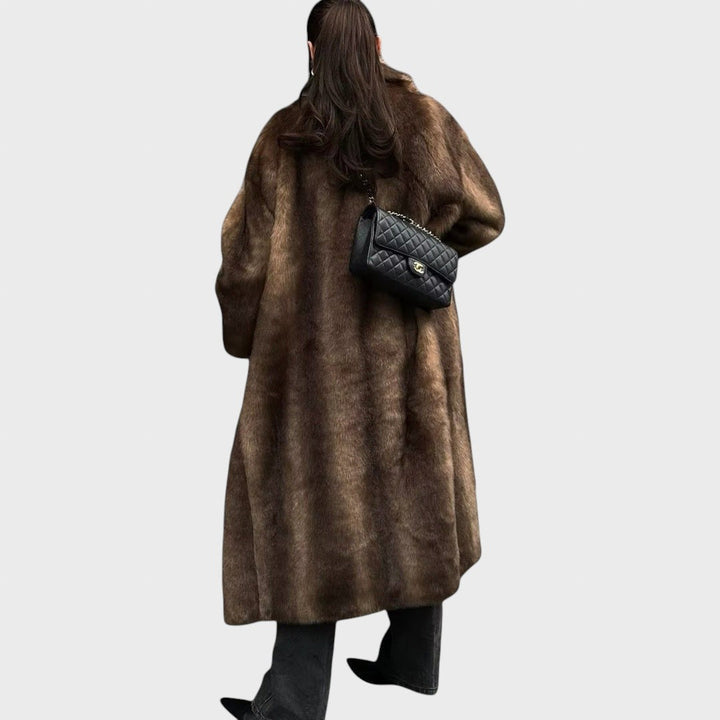 Pūkūtė | Long faux leather coat