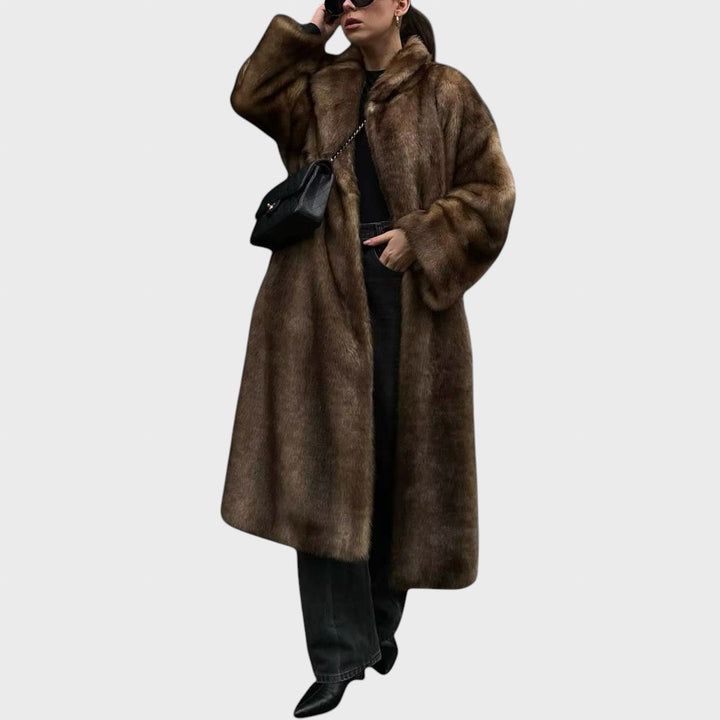 Pūkūtė | Long faux leather coat